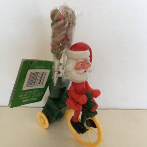 Retro wind up Santa riding a bicycle Christmas toy collectible holiday decor